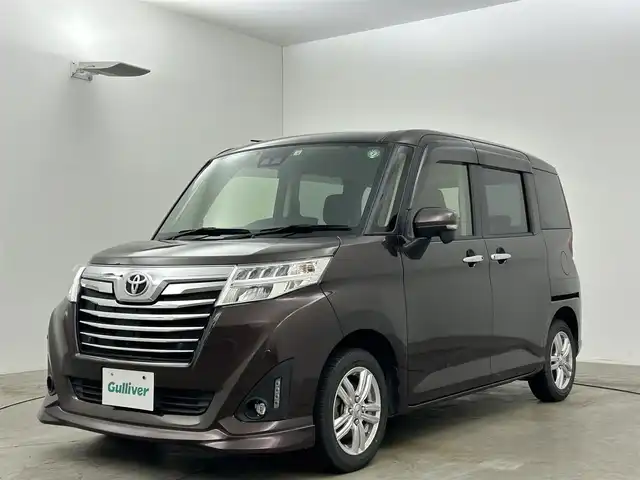 トヨタ ルーミー カスタムG 岡山県 2020(令2)年 6万km プラムブラウンパールクリスタルシャイン 純正SDナビ/（CD/DVD/BT/フルセグTV）/バックカメラ/両側パワースライドドア/コーナーセンサー/LEDヘッドライト/オートライト/前席シートヒーター/純正14インチアルミホイール/TVキャンセラー/ETC/ISOFIX/後席サンシェイド/ステアリングスイッチ/チルトステアリング/シートリフター/シートバックテーブル/ウインカーミラー/ドアバイザー