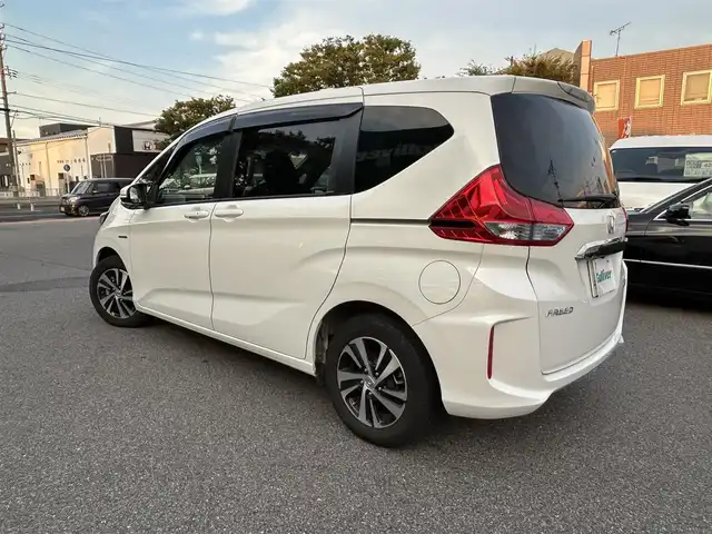 ホンダ フリード ハイブリット EX 鳥取県 2018(平30)年 4.5万km ホワイトオーキッドパール ホンダセンシング/・LKAS〈車線維持支援システム〉/・追突軽減ブレーキ〈CMBS〉/・誤発進抑制機能/・アダプティブ・クルーズ・コントロール/・歩行者事故低減ステアリング/・路外逸脱抑制機能/・先行車発進お知らせ機能/・標識認識機能/carrozzeriaナビ【AVIC-CZ910】/・フルセグ/CD/DVD/Bluetooth/バックモニター/carrozzeria10.2型フリップダウンモニター【TVM-FW1030】/両側電動スライドドア/LEDヘッドライト/オートライト/ビルトインETC/ハーフレザーシート/前席シートヒーター/スマートキー/プッシュスタート/純正AW/W＆サイドエアバック/カーテンエアバック