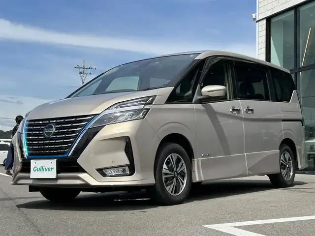日産 セレナ e－パワー ハイウェイスター V 愛媛県 2020(令2)年 3.7万km カシミヤグレージュ Strada7型ナビ/社外12インチ天吊モニター/両側電動スライド/左側ハンズフリースライド/プロパイロット/全周囲カメラ/クリアランスソナー/ドライブレコーダー/インテリジェントルームミラー/ブラインドスポットモニター/電動パーキングブレーキ/AutoHold/LEDヘッドライト/電格ミラー/純正ドアバイザー/ISOFIX/現状サマー(純正AW)(195/65/R15)/DUNLOP ENASAVE EC300＋