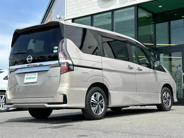 日産 セレナ e－パワー ハイウェイスター V 愛媛県 2020(令2)年 3.7万km カシミヤグレージュ Strada7型ナビ/社外12インチ天吊モニター/両側電動スライド/左側ハンズフリースライド/プロパイロット/全周囲カメラ/クリアランスソナー/ドライブレコーダー/インテリジェントルームミラー/ブラインドスポットモニター/電動パーキングブレーキ/AutoHold/LEDヘッドライト/電格ミラー/純正ドアバイザー/ISOFIX/現状サマー(純正AW)(195/65/R15)/DUNLOP ENASAVE EC300＋