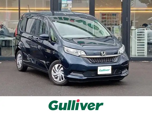 ホンダ フリード G ホンダセンシング 福井県 2021(令3)年 1.5万km ミッドナイトブルービームM 後席用フリップダウンモニター/純正9インチナビ/フルセグテレビ/アダプティブクルーズコントロール/前方ドライブレコーダー/ビルトインETC/両側パワースライドドア/バックカメラ/LEDヘッドライト/前席シートヒーター/衝突被害軽減システム/レーンキープアシスト/横滑り防止装置/盗難防止装置/ワイパーデアイサー/サンシェード/電格ミラー/純正ホイルキャップ/純正フロアマット/スマートキー