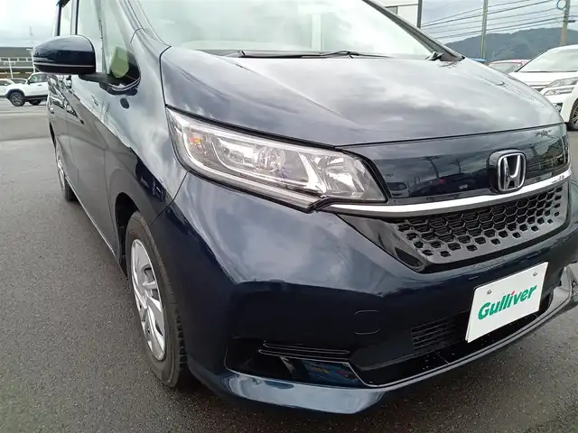 ホンダ フリード G ホンダセンシング 福井県 2021(令3)年 1.5万km ミッドナイトブルービームM 後席用フリップダウンモニター/純正9インチナビ/フルセグテレビ/アダプティブクルーズコントロール/前方ドライブレコーダー/ビルトインETC/両側パワースライドドア/バックカメラ/LEDヘッドライト/前席シートヒーター/衝突被害軽減システム/レーンキープアシスト/横滑り防止装置/盗難防止装置/ワイパーデアイサー/サンシェード/電格ミラー/純正ホイルキャップ/純正フロアマット/スマートキー