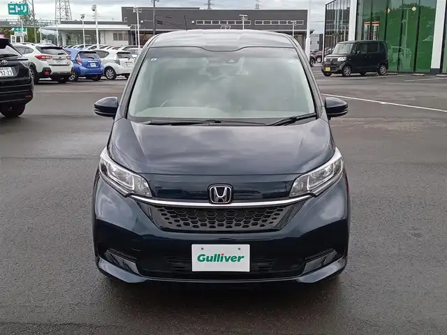 ホンダ フリード G ホンダセンシング 福井県 2021(令3)年 1.5万km ミッドナイトブルービームM 後席用フリップダウンモニター/純正9インチナビ/フルセグテレビ/アダプティブクルーズコントロール/前方ドライブレコーダー/ビルトインETC/両側パワースライドドア/バックカメラ/LEDヘッドライト/前席シートヒーター/衝突被害軽減システム/レーンキープアシスト/横滑り防止装置/盗難防止装置/ワイパーデアイサー/サンシェード/電格ミラー/純正ホイルキャップ/純正フロアマット/スマートキー