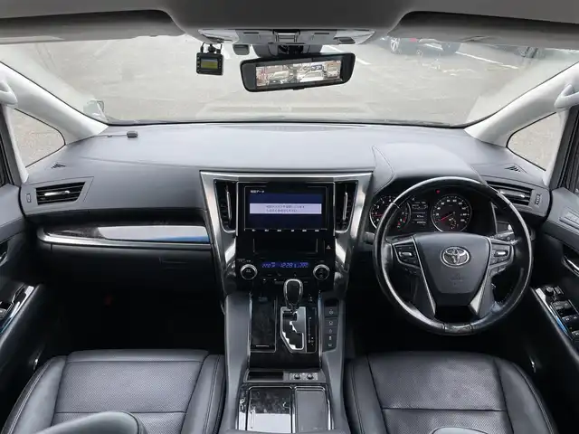 トヨタ ヴェルファイア Z Gエディション 道央・札幌 2019(令1)年 4.6万km バーニングブラッククリスタルシャインガラスフレーク ４WD/純正ディーラーOPナビ/CD/DVD/BT/フルセグ/トヨタセーフティセンス/プリクラッシュセーフティ/横滑り防止装置/レーダークルーズコントロール/レーンキープアシスト/クリアランスソナー/ブラインドスポットモニター/パーキングサポートブレーキ/ロードサインアシスト/バックカメラ/ビルトインETC2.0/ドライブレコーダー/アイドリングストップ/ECOMODE/両側パワースライドドア/パワーバックドア/前席/２列目パワーシート/D席メモリーシート/前席シートヒーター/前席エアシート/レザーシート/革巻きウッドコンビステアリング/ステアリングリモコン/ハンドルヒーター/AC100V/電動パーキング/ブレーキホールド/MTモード付AT/プッシュスタート/スマートキー/LEDヘッドライト/オートライト/フォグランプ/電動格納ミラー/ウィンカーミラー/フロアマット/ドアバイザー/純正AW付夏タイヤ積込/235/50/R18/2019年/山6mm