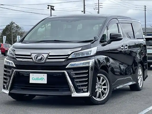 トヨタ ヴェルファイア Z Gエディション 道央・札幌 2019(令1)年 4.6万km バーニングブラッククリスタルシャインガラスフレーク ４WD/純正ディーラーOPナビ/CD/DVD/BT/フルセグ/トヨタセーフティセンス/プリクラッシュセーフティ/横滑り防止装置/レーダークルーズコントロール/レーンキープアシスト/クリアランスソナー/ブラインドスポットモニター/パーキングサポートブレーキ/ロードサインアシスト/バックカメラ/ビルトインETC2.0/ドライブレコーダー/アイドリングストップ/ECOMODE/両側パワースライドドア/パワーバックドア/前席/２列目パワーシート/D席メモリーシート/前席シートヒーター/前席エアシート/レザーシート/革巻きウッドコンビステアリング/ステアリングリモコン/ハンドルヒーター/AC100V/電動パーキング/ブレーキホールド/MTモード付AT/プッシュスタート/スマートキー/LEDヘッドライト/オートライト/フォグランプ/電動格納ミラー/ウィンカーミラー/フロアマット/ドアバイザー/純正AW付夏タイヤ積込/235/50/R18/2019年/山6mm