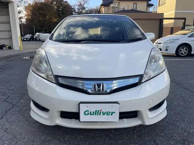 ホンダ フィット シャトル ハイブリッド ナビプレミアムセレ 千葉県 2011(平23)年 11.5万km プレミアムホワイトパール 純正HDDナビ/FM.AM / CD.DVD / TV/バックカメラ/ステアリングリモコン/クルーズコントロール/ハーフレザー/HIDヘッドライト/オートライト/フォグランプ/電動格納式ドアミラー/ウィンカーミラー/ETC/ドアバイザー/フロアマット/スペアキー/保証書/取扱説明書