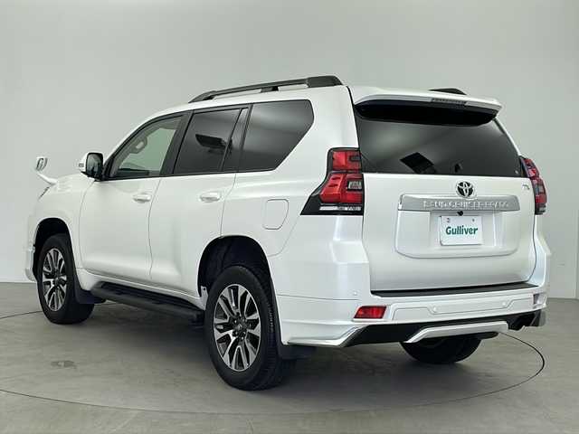 トヨタ ランドクルーザー プラド TX Lパッケージ 鹿児島県 2022(令4)年 1.8万km ホワイトパールクリスタルシャイン Toyota Safety Sense/純正9型ナビ/Bluetooth DVD再生可/フルセグTV/バックカメラ/モデリスタエアロ(F/R)/サンルーフ/ベージュレザーシート /・前席シートヒーター /・前席エアシート/レーダークルーズコントロール/電動サードシート/ビルトインETC/純正19インチアルミホイール/ルーフレール/LEDヘッドライト/フォグライト /オートライトコントロール/スマートキー/エンジンプッシュスタート/純正フロアマット/保証書