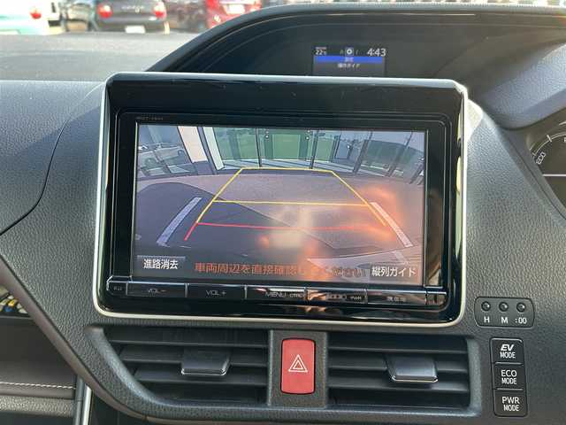 トヨタ エスクァイア ハイブリッド Gi 和歌山県 2014(平26)年 10.5万km ダークバイオレットマイカメタリック 純正ナビ/フルセグTV/バックカメラ/（BT/CD/DVD/MSV）/フリップダウンモニター/車両接近通報/トラクションコントロール/クルーズコントロール/両側パワースライドドア/前方ドラレコ/置くだけ充電/ビルトインETC/レザーシート/プッシュスタート/スマートキー/オートライト/ISOFIX/リアサンシェード/ドアバイザー/nanoe