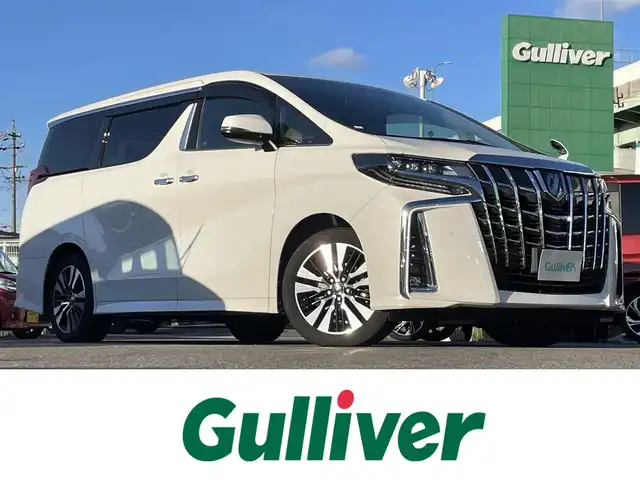 トヨタ アルファード S Cパッケージ 愛知県 2021(令3)年 3.6万km ホワイトパールクリスタルシャイン 純正ディスプレイオーディオ/(CD/DVD/Bluetooth/フルセグTV)/バックカメラ/純正フリップダウンモニター/両側パワースライドドア/パワーバックドア/黒レザーシート/前席シートヒーター&エアコンシート/前席&2ndパワーシート/オットマン/ドライブレコーダー/ETC2.0/LEDヘッドライト/フォグランプ/レーダークルーズコントロール/PCS/nanoe