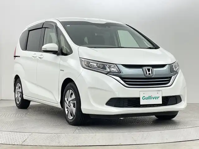 ホンダ フリード ハイブリット G ホンダセンシング 新潟県 2018(平30)年 2.6万km ホワイトオーキッドパール ホンダセンシング/　・衝突被害軽減ブレーキ/　・レーンキープアシスト/　・アダプティブクルーズコントロール/純正ナビ/　（フルセグTV/BT/CD/DVD/AM/FM）/バックカメラ/両側パワースライドドア/LEDオートライト/ステアリングスイッチ/スマートキー/ビルトインETC