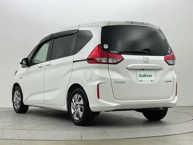 ホンダ フリード ハイブリット G ホンダセンシング 新潟県 2018(平30)年 2.6万km ホワイトオーキッドパール ホンダセンシング/　・衝突被害軽減ブレーキ/　・レーンキープアシスト/　・アダプティブクルーズコントロール/純正ナビ/　（フルセグTV/BT/CD/DVD/AM/FM）/バックカメラ/両側パワースライドドア/LEDオートライト/ステアリングスイッチ/スマートキー/ビルトインETC