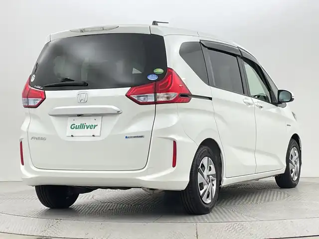 ホンダ フリード ハイブリット G ホンダセンシング 新潟県 2018(平30)年 2.6万km ホワイトオーキッドパール ホンダセンシング/　・衝突被害軽減ブレーキ/　・レーンキープアシスト/　・アダプティブクルーズコントロール/純正ナビ/　（フルセグTV/BT/CD/DVD/AM/FM）/バックカメラ/両側パワースライドドア/LEDオートライト/ステアリングスイッチ/スマートキー/ビルトインETC