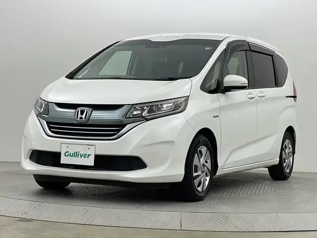 ホンダ フリード ハイブリット G ホンダセンシング 新潟県 2018(平30)年 2.6万km ホワイトオーキッドパール ホンダセンシング/　・衝突被害軽減ブレーキ/　・レーンキープアシスト/　・アダプティブクルーズコントロール/純正ナビ/　（フルセグTV/BT/CD/DVD/AM/FM）/バックカメラ/両側パワースライドドア/LEDオートライト/ステアリングスイッチ/スマートキー/ビルトインETC