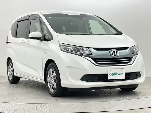 ホンダ フリード ハイブリット G ホンダセンシング 新潟県 2018(平30)年 2.6万km ホワイトオーキッドパール ホンダセンシング/　・衝突被害軽減ブレーキ/　・レーンキープアシスト/　・アダプティブクルーズコントロール/純正ナビ/　（フルセグTV/BT/CD/DVD/AM/FM）/バックカメラ/両側パワースライドドア/LEDオートライト/ステアリングスイッチ/スマートキー/ビルトインETC