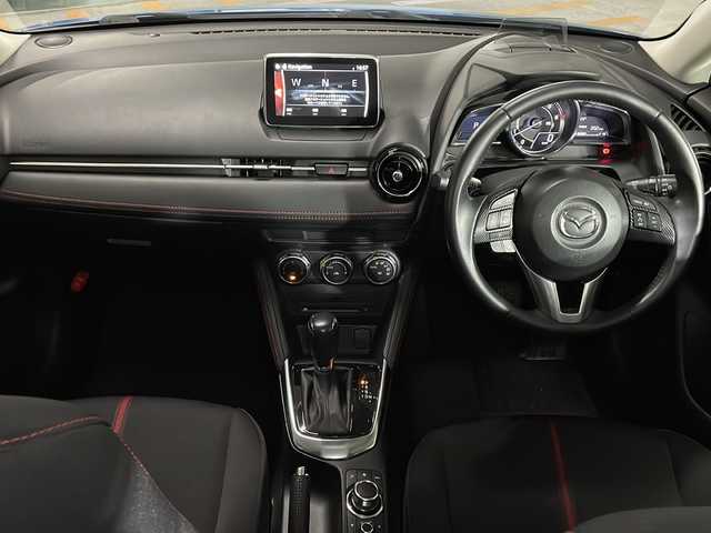 マツダ デミオ XD ツーリング 広島県 2015(平27)年 5.7万km ダイナミックブルーマイカ 純正ナビ　/バックカメラ　/フルセグＴＶ　/リアエアロ　/クルーズコントロール　/衝突軽減ブレーキ　/ＬＥＤヘッドランプ　/オートライト　/フォグランプ　/Ｂｌｕｅｔｏｏｔｈ　/スマートキー　/純正フロアマット　/ＥＴＣ/純正１６インチアルミホイール(185/60/R16)/エアバック（運転席/助手席/サイド/カーテン）