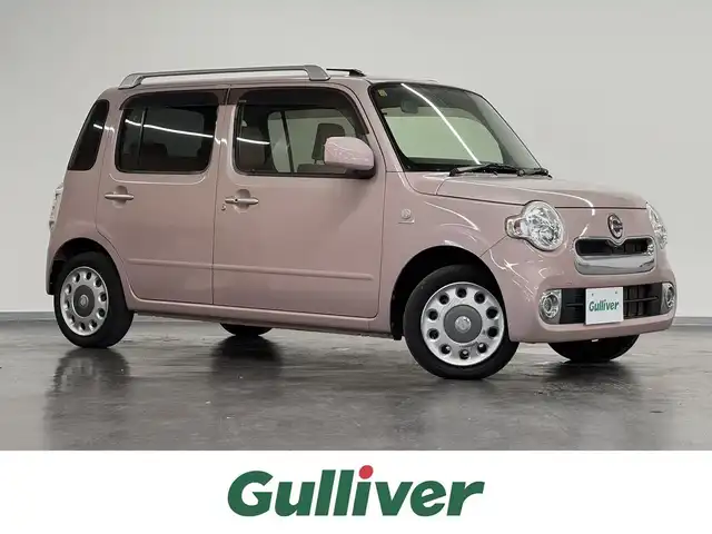 ダイハツ ミラ ココア プラスX 三重県 2015(平27)年 5.7万km ムースピンクパール ガソリン/FF/インパネCVT/純正 7インチナビ NSDN-W60/（AM/FM/CD/DVD/地デジTV/SD/AUX）/ルーフレール/ETC/安全/・ABS/・助手席エアバッグ/装備/・キーフリーシステム/・スマートキーx1/・オートエアコン/・LEDヘッドランプ（打替？）/・電動格納ドアミラー/・全ドアパワーウインドウ/・パワーステアリング/・チルトステアリング機構/・ベンチシート/・純正ホイールキャップ＆14インチスチールホイール/・保/車両取