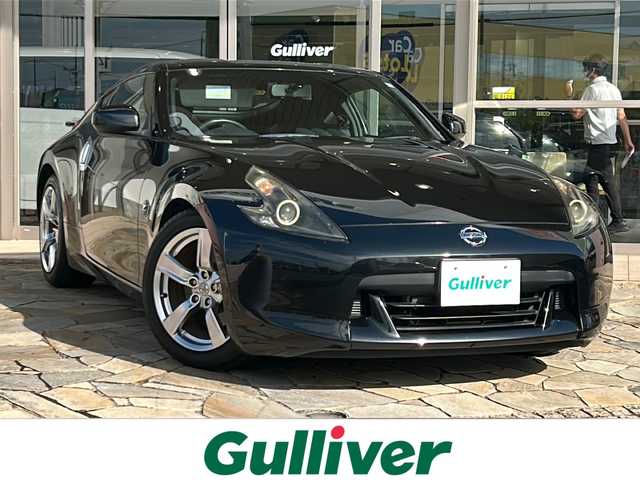 日産 フェアレディ Ｚ 静岡県 2009(平21)年 7.4万km ダイヤモンドブラック 純正メモリナビ/・CD/・DVD/・AM/・FM/主要装備/・アイドリングストップ/・パドルシフト/・ビルトインＥＴＣ/・オートライト/・ステアリングリモコン/・純正フロアマット/・純正アルミホイール/・カーテンエアバック/・スマートキー/・プッシュスタート