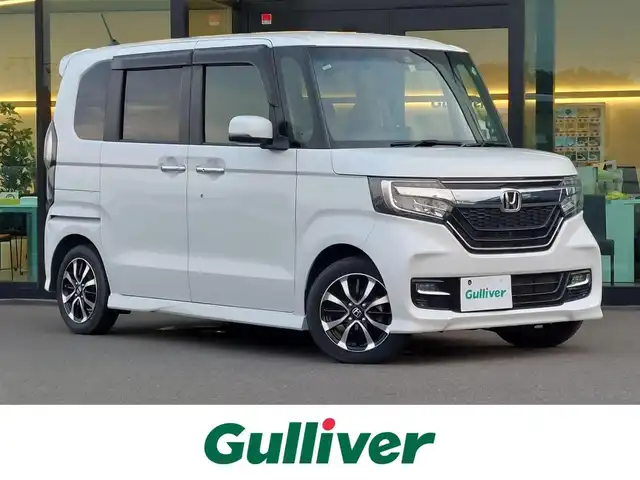 ホンダ Ｎ ＢＯＸ カスタム G L ホンダセンシング 東京都 2020(令2)年 2.1万km プラチナホワイトパール ホンダセンシング/・衝突軽減ブレーキ/・誤発進抑制機能/・路外逸脱抑制機能/・アダプティブクルーズコントロール/プッシュスタート/純正ナビ/(FM/AM/Bluetooth/CD/ワンセグTV）/バックカメラ/片側パワースライドドア/ベンチシート/後席ロールサンシェード/LEDヘッドライト/オートライト/ドアバイザ―/14インチ純正アルミホイール/スマートキー