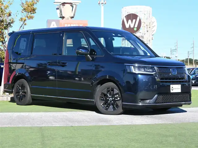 ホンダ ステップワゴン スパーダ eHEV 千葉県 2022(令4)年 4.5万km ミッドナイトブルービームM ホンダセンシング/・衝突軽減ブレーキ（CMBS）/・車線維持支援システム（LKAS）/・アダプティブクルーズコントロール（ACC）/・後方誤発進抑制機能/・誤発進抑制機能/・ブラインドスポットインフォメーション/パワーバックドア/両側パワースライドドア/ハーフレザーシート/前席シートヒーター/後席オットマン/純正メモリーナビ/地デジTV/【DVD/CD再生機能　Bluetooth接続】/バックカメラ/ドライブレコーダー（前後撮影）/フリップダウンモニター（VM-221T）/革巻きステアリング/ステアリングスイッチ/パドルシフト/ETC/LEDヘッドライト/フォグライト/ウインカーミラー/コーナーセンサー/純正16インチアルミホイル/サイド/カーテンエアバッグ/Honda スマートキー