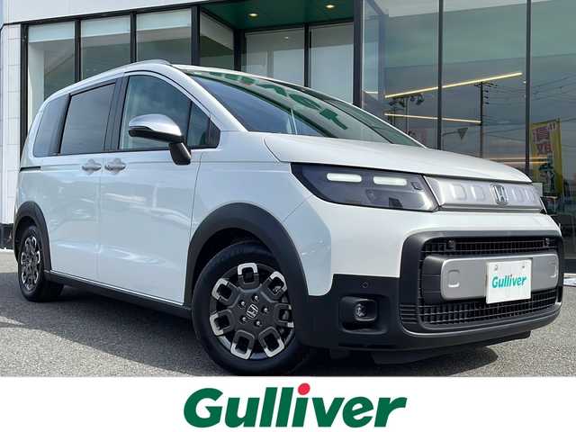 ホンダ フリード クロスター 兵庫県 2025(令7)年 1.3万km プラチナホワイトパール 純正８型ナビ/・TV.BT.AM.FM/衝突軽減装置/踏み間違え加速抑制システム/先行車発信お知らせ機能/標識認識機能/レーダークルーズコントロール/ブラインドスポットモニター/クリアランスソナー/バックカメラ/電動パーキングブレーキ/ブレーキホールド/前席シートヒーター/オートハイビーム/カーテンエアバック/純正フロアマット