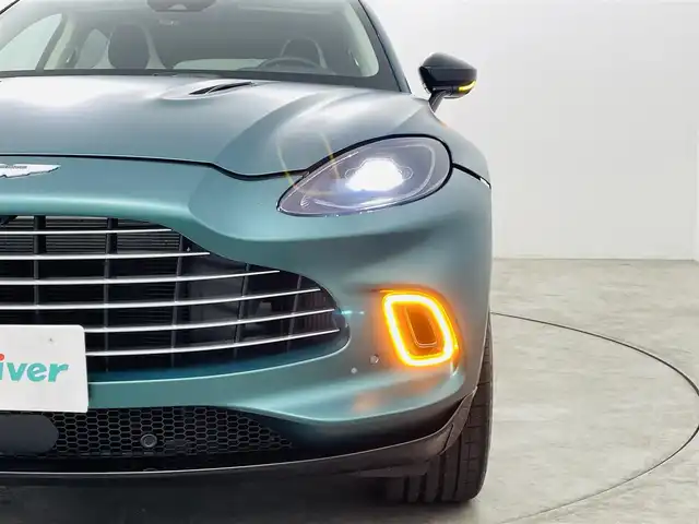 アストンマーティン Ａ・マーチン ＤＢＸ 707 福島県 2022(令4)年 0.2万km 緑 アクティブブレーキアシストシステム/・コーナーセンサー/・パーキングアシスト/パノラミックガラスルーフ/純正ワイドナビ/・BT/FM/AM/アップルカープレイ/バックカメラ/LEDヘッドライト/・フォグライト/シートヒーター/・エアーシート/純正アルミホイール付きサマータイヤ/ドラレコ/ハイエンドオーディオシステム/アイドリングストップ/プッシュスタート/・スマートキー