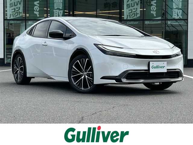トヨタ プリウス Z 岡山県 2023(令5)年 5.2万km プラチナホワイトパールマイカ 純正12.3インチナビ/（AM.FM.TV.BT.Miracast）/パノラミックビューモニター/トヨタセーフティーセンス/・レーンディパーチャアラート/・プリクラッシュセーフティ/・アダプティブクルーズコントロール/・オートマチックハイビーム/AC100V/パワーバックドア/D席パワーシート/前席シートヒーター/ベンチレーション/ステアリングヒーター/アドバンスドパーク/ETC2.0/ブラインドスポットモニター/純正19インチアルミホイール