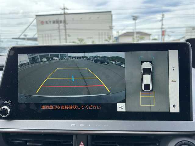 トヨタ プリウス Z 岡山県 2023(令5)年 5.2万km プラチナホワイトパールマイカ 純正12.3インチナビ/（AM.FM.TV.BT.Miracast）/パノラミックビューモニター/トヨタセーフティーセンス/・レーンディパーチャアラート/・プリクラッシュセーフティ/・アダプティブクルーズコントロール/・オートマチックハイビーム/AC100V/パワーバックドア/D席パワーシート/前席シートヒーター/ベンチレーション/ステアリングヒーター/アドバンスドパーク/ETC2.0/ブラインドスポットモニター/純正19インチアルミホイール