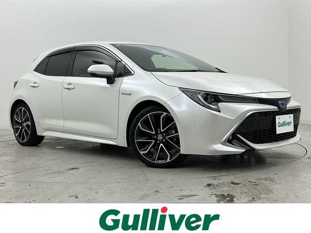 トヨタ カローラ スポーツ ハイブリッドG Z 宮城県 2019(令1)年 5.3万km ホワイトパールクリスタルシャイン 禁煙車/ワンオーナー/トヨタセーフティーセンス/・レーダークルーズコントロール/・プリクラッシュセーフティーシステム/・レーントレーシングアシスト/・オートマチックハイビーム/・リアクロストラフィックアラート/・パーキングサポートブレーキ/・ロードサインアシスト/ブラインドスポットモニター/純正9インチナビ/（BT.CD.DVD.AM.FM.USB）/フルセグテレビ/バックカメラ/社外ドライブレコーダー（F）/ビルトインETC/電動パーキングブレーキ/AUTOHOLD/前席シートヒーター/革巻きステアリング/ステアリングスイッチ/プッシュスタート/スマートキー/スペアキー/純正フロアマット/純正ドアバイザー/純正18インチアルミホイール/LEDヘッドライト/LEDフォグランプ/アイドリングストップ/横滑り防止機能