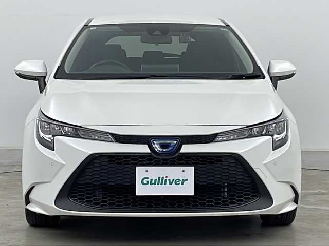 トヨタ カローラツーリング ハイブリッド G－X プラス 道央・札幌 2021(令3)年 5.2万km ホワイトパールクリスタルシャイン ・4WD/・純正ナビ&BT&USB/・トヨタセーフティセンス/・プリクラッシュセーフティ/・ロードサインアシスト/・レーンディパーチャーアラート/・レーダークルーズコントロール/・クリアランスソナー/・ブラインドスポットモニター/・オートホールドブレーキ/・社外ドライブレコーダー/・純正フロアマット/・AC100V/・オートマチックハイビーム/・オートライト/・LEDヘッドライト/・ヘッドライトレベライザー/・ステアリングスイッチ/・ビルトインETC/・横滑り防止/・スマートキー/・プッシュスタート/・電格ミラー