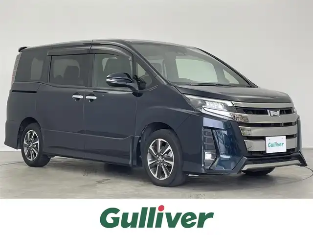 トヨタ ノア Si ダブルバイビー 埼玉県 2018(平30)年 5.4万km ブラッキッシュアゲハガラスフレーク Toyota Safety Sense/純正9インチナビ/【CD・DVD・SD・BT・フルセグTV】/バックカメラ/両側パワースライドドア/純正フリップダウンモニター/純正ドライブレコーダー/クルーズコントロール/リアサンシェード/オートライト/LEDヘッドライト/LEDフォグライト/ビルトインETC /ウィンカーミラー/電動格納ミラー/スマートキー