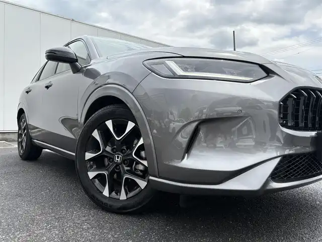 ホンダ ＺＲ－Ｖ ハイブリッド e:HEV Z 三重県 2024(令6)年 0.5万km スーパープラチナグレーメタリック マルチビューカメラシステム/ホンダコネクトディスプレー(9インチワイドディスプレイ/AppleCarPlay/AndroidAuto/Bluetooth/インターナビ/地デジTV/AM/FM/ハンズフリー機能/先読みエコアシスト)/ブラインドスポットモニター/ホンダセンシング(衝突軽減ブレーキ/誤発進抑制/後方誤発進抑制/近距離衝突軽減ブレーキ/歩行者事故低減ステアリング/路外逸脱抑制/渋滞追従機能付アダプティブクルーズコントロール/車線維持支援システム/トラフィックジャムアシスト/先行車発進お知らせ/標識認識/オートハイビーム/ブラインドスポットインフォメーション/パーキングセンサーシステム/後退出庫サポート)/ETC2.0/ドライブレコーダー/ステアリングヒーター/シートヒーター(前席)/ワイヤレス充電器/パワーバックドア/ステアリングスイッチ/パドルシフト/パワーシート(前席)/ドライビングポジションシステム(運転席)/LEDヘッドランプ/アクティブコーナーリングライト/ダウンサス(RSR(Ti2000))/スペアキー