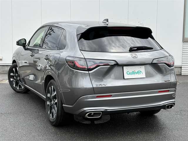 ホンダ ＺＲ－Ｖ ハイブリッド e:HEV Z 福岡県 2024(令6)年 0.5万km スーパープラチナグレーメタリック マルチビューカメラシステム/ホンダコネクトディスプレー(9インチワイドディスプレイ/AppleCarPlay/AndroidAuto/Bluetooth/インターナビ/地デジTV/AM/FM/ハンズフリー機能/先読みエコアシスト)/ブラインドスポットモニター/ホンダセンシング(衝突軽減ブレーキ/誤発進抑制/後方誤発進抑制/近距離衝突軽減ブレーキ/歩行者事故低減ステアリング/路外逸脱抑制/渋滞追従機能付アダプティブクルーズコントロール/車線維持支援システム/トラフィックジャムアシスト/先行車発進お知らせ/標識認識/オートハイビーム/ブラインドスポットインフォメーション/パーキングセンサーシステム/後退出庫サポート)/ETC2.0/ドライブレコーダー/ステアリングヒーター/シートヒーター(前席)/ワイヤレス充電器/パワーバックドア/ステアリングスイッチ/パドルシフト/パワーシート(前席)/ドライビングポジションシステム(運転席)/LEDヘッドランプ/アクティブコーナーリングライト/ダウンサス(RSR(Ti2000))/スペアキー
