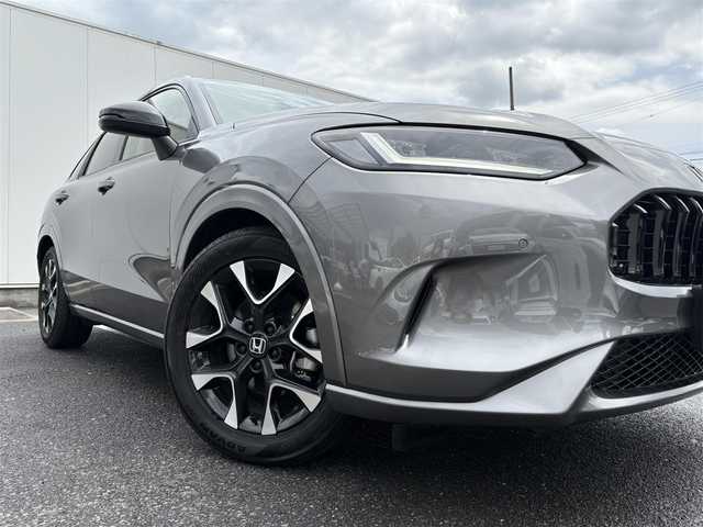 ホンダ ＺＲ－Ｖ ハイブリッド e:HEV Z 福岡県 2024(令6)年 0.5万km スーパープラチナグレーメタリック マルチビューカメラシステム/ホンダコネクトディスプレー(9インチワイドディスプレイ/AppleCarPlay/AndroidAuto/Bluetooth/インターナビ/地デジTV/AM/FM/ハンズフリー機能/先読みエコアシスト)/ブラインドスポットモニター/ホンダセンシング(衝突軽減ブレーキ/誤発進抑制/後方誤発進抑制/近距離衝突軽減ブレーキ/歩行者事故低減ステアリング/路外逸脱抑制/渋滞追従機能付アダプティブクルーズコントロール/車線維持支援システム/トラフィックジャムアシスト/先行車発進お知らせ/標識認識/オートハイビーム/ブラインドスポットインフォメーション/パーキングセンサーシステム/後退出庫サポート)/ETC2.0/ドライブレコーダー/ステアリングヒーター/シートヒーター(前席)/ワイヤレス充電器/パワーバックドア/ステアリングスイッチ/パドルシフト/パワーシート(前席)/ドライビングポジションシステム(運転席)/LEDヘッドランプ/アクティブコーナーリングライト/ダウンサス(RSR(Ti2000))/スペアキー