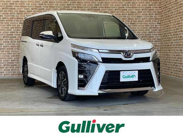 トヨタ ヴォクシー ZS 煌 岩手県 2018(平30)年 6.9万km ホワイトパールクリスタルシャイン ４WD　/両側パワースライドドア　/トヨタセーフティセンス/クルーズコントロール　/アイドリングストップ/MT付きAT/ETC2.0/ドライブレコーダー　/純正ナビ/クルーズコントロール/レーンアシスト　/ LEDヘットライト/プリクラッシュセーフティ　/純正１６インチアルミホイール　　/3列シート　/ステアリングスイッチ/ウォークスルー