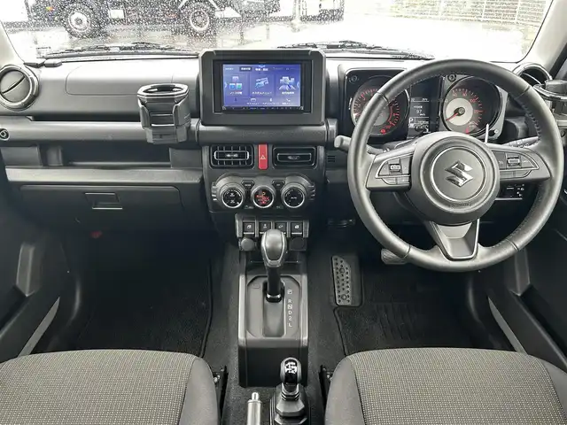 スズキ ジムニー XC 大阪府 2024(令6)年 1.5万km ミディアムグレー 社外ナビ　/　 ＴＶ/CD/DVD/Bluetooth　/バックモニター　/衝突軽減ブレーキ/リアコーナーセンサー　/前席シートヒーター　/スマートルームミラー/クルーズコントロール/レーンキープアシスト　/アイドリングストップ/前方ドライブレコーダー/純正フロアマット/純正16インチアルミホイール/ルーフレール/プッシュスタート　/スマートキー　/ＥＴＣ/ＬＥＤ