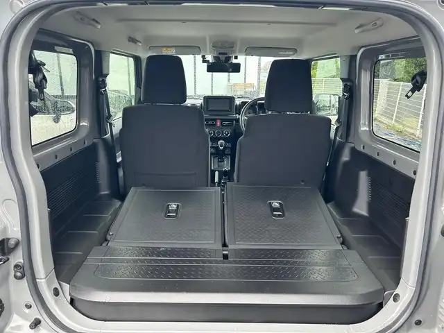 スズキ ジムニー XC 大阪府 2024(令6)年 1.5万km ミディアムグレー 社外ナビ　/　 ＴＶ/CD/DVD/Bluetooth　/バックモニター　/衝突軽減ブレーキ/リアコーナーセンサー　/前席シートヒーター　/スマートルームミラー/クルーズコントロール/レーンキープアシスト　/アイドリングストップ/前方ドライブレコーダー/純正フロアマット/純正16インチアルミホイール/ルーフレール/プッシュスタート　/スマートキー　/ＥＴＣ/ＬＥＤ