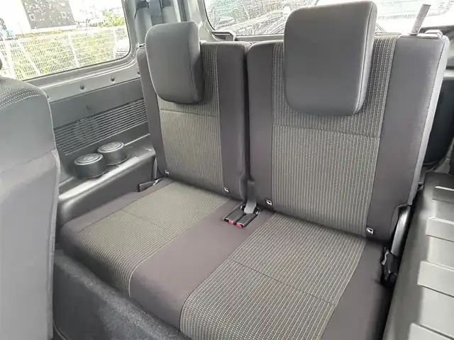 スズキ ジムニー XC 大阪府 2024(令6)年 1.5万km ミディアムグレー 社外ナビ　/　 ＴＶ/CD/DVD/Bluetooth　/バックモニター　/衝突軽減ブレーキ/リアコーナーセンサー　/前席シートヒーター　/スマートルームミラー/クルーズコントロール/レーンキープアシスト　/アイドリングストップ/前方ドライブレコーダー/純正フロアマット/純正16インチアルミホイール/ルーフレール/プッシュスタート　/スマートキー　/ＥＴＣ/ＬＥＤ
