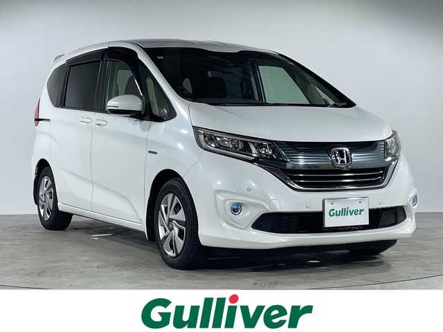 ホンダ フリード ハイブリット G ホンダセンシング 福岡県 2019(平31)年 9.7万km ホワイトオーキッドパール 純正メモリナビ/フルセグテレビ/バックカメラ/両側パワースライドドア/ドライブレコーダー/プッシュスタート/ETC/レーダークルーズコントロール/純正フロアマット