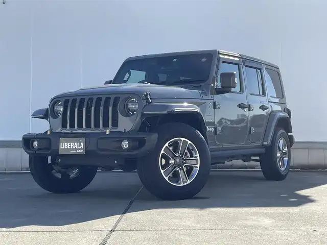 クライスラー・ジープ ジープ ラングラー LTD ED withサンライダー フリップT for HT 東京都 2022(令4)年 2.5万km グレー 純正ナビ/フルセグTV/バックカメラ/シートヒーター/ETC2.0/前後ドライブレコーダー（デジタルインナーミラー付き）/サンライダーフリップトップ/ステアリングヒーター/純正18インチアルミホイール/社外ステアリングダンパー/社外ボンネットキャッチ/牽引フック