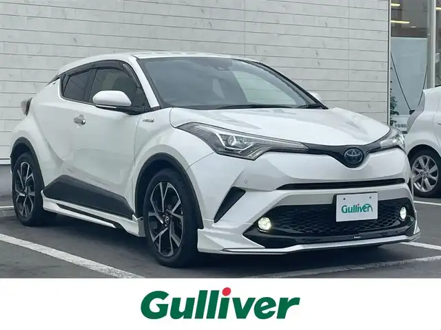 トヨタ Ｃ－ＨＲ G LEDエディション 静岡県 2017(平29)年 4.9万km ホワイトパールクリスタルシャイン ワンオーナー/純正ナビ(Bluetooth/CD/DVD/SD/フルセグ)/モデリスタフルエアロ/バックカメラ/ブラインドスポットモニター/衝突被害軽減システム/追従型クルーズコントロール/LEDヘッドライト/フォグランプ/オートライト/オートマチックハイビーム/ハーフレザーシート/D/N席シートヒーター/ビルトインETC/純正18インチアルミホイール/純正フロアマット/革巻きステアリング/ステアリングスイッチ