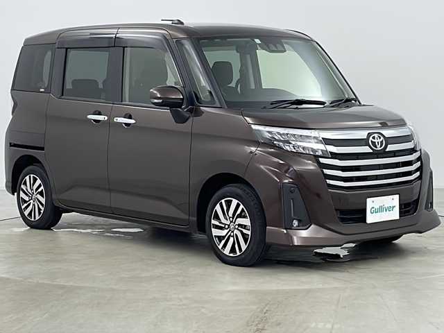 トヨタ ルーミー カスタムG 道央・札幌 2023(令5)年 1.1万km プラムブラウンパールクリスタルシャイン ・4WD/・純正ナビ&TV&CD&DVD&SD&BT/・バックカメラ/・両側パワースライドドア/・スマートアシスト/・衝突回避支援ブレーキ/・車線逸脱警報/・先行車発進お知らせ/・アダプティブクルーズコントロール/・ふらつき警報/・前席シートヒーター/・アイドリングストップ/・プッシュスタート/・コーナーセンサー/・LEDヘッドライト/・オートライト/・フォグランプ/・スマートキー/・純正14インチAW