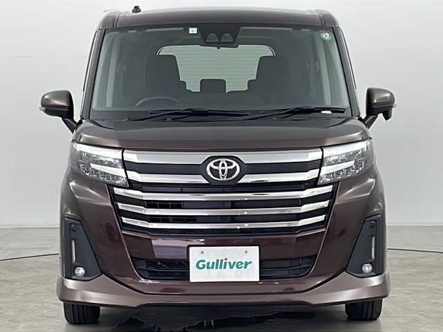 トヨタ ルーミー カスタムG 道央・札幌 2023(令5)年 1.1万km プラムブラウンパールクリスタルシャイン ・4WD/・純正ナビ&TV&CD&DVD&SD&BT/・バックカメラ/・両側パワースライドドア/・スマートアシスト/・衝突回避支援ブレーキ/・車線逸脱警報/・先行車発進お知らせ/・アダプティブクルーズコントロール/・ふらつき警報/・前席シートヒーター/・アイドリングストップ/・プッシュスタート/・コーナーセンサー/・LEDヘッドライト/・オートライト/・フォグランプ/・スマートキー/・純正14インチAW