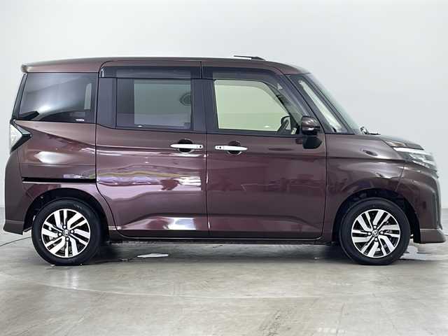 トヨタ ルーミー カスタムG 道央・札幌 2023(令5)年 1.1万km プラムブラウンパールクリスタルシャイン ・4WD/・純正ナビ&TV&CD&DVD&SD&BT/・バックカメラ/・両側パワースライドドア/・スマートアシスト/・衝突回避支援ブレーキ/・車線逸脱警報/・先行車発進お知らせ/・アダプティブクルーズコントロール/・ふらつき警報/・前席シートヒーター/・アイドリングストップ/・プッシュスタート/・コーナーセンサー/・LEDヘッドライト/・オートライト/・フォグランプ/・スマートキー/・純正14インチAW