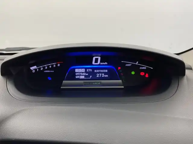 ホンダ フリード ハイブリット ジャストセレクション+ 新潟県 2013(平25)年 9.8万km プレミアムスパークルブラックパール クルーズコントロール/両側パワースライドドア/横滑り防止装置/ＥＴＣ・ステアリングスイッチ/両側パワースライドドア/純正ディーラーオプションナビ/フルセグテレビ/スタッドレスタイヤ１５インチ