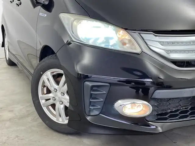 ホンダ フリード ハイブリット ジャストセレクション+ 新潟県 2013(平25)年 9.8万km プレミアムスパークルブラックパール クルーズコントロール/両側パワースライドドア/横滑り防止装置/ＥＴＣ・ステアリングスイッチ/両側パワースライドドア/純正ディーラーオプションナビ/フルセグテレビ/スタッドレスタイヤ１５インチ