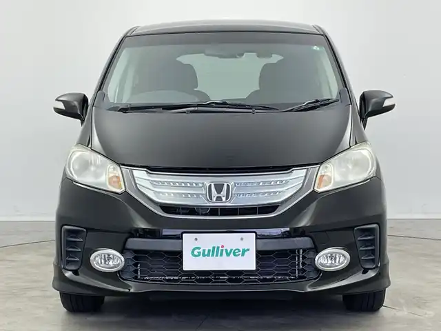 ホンダ フリード ハイブリット ジャストセレクション+ 新潟県 2013(平25)年 9.8万km プレミアムスパークルブラックパール クルーズコントロール/両側パワースライドドア/横滑り防止装置/ＥＴＣ・ステアリングスイッチ/両側パワースライドドア/純正ディーラーオプションナビ/フルセグテレビ/スタッドレスタイヤ１５インチ