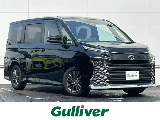 トヨタ ヴォクシー S－G 佐賀県 2023(令5)年 1.5万km アティチュードブラックマイカ 快適利便パッケージ/・ハンズフリーデュアルパワースライドドア/・左右独立フロントオートエアコン/・リヤオートエアコン/・前席シートヒーター/・ステアリングヒーター/トヨタセーフティセンス/レーダークルーズコントロール/パーキングサポートブレーキ/アドバンストドライブ/ブラインドスポットモニター/クリアランスソナー/純正10.5インチディスプレイオーディオ/・コネクティッドナビ/・バックカメラ/・フルセグTV/BT/CD/DVD/ETC2.0/ハンズフリーデュアルパワースライドドア/純正16インチAw/LEDヘッドライト/フォグランプ/スペアキー×1/保証書/取扱説明書