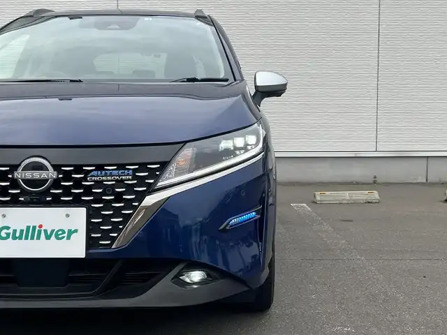 日産 ノート オーテック クロスオーバーFOUR 秋田県 2022(令4)年 0.9万km オーロラフレアブルーパール 4WD/純正メモリナビ/ BT/USB/フルセグ/アラウンドビューモニター/デジタルインナーミラー /プロパイロット/ハンドル支援/エマージェンシーブレーキ/レーダークルーズコントロール/レーンキープ /コーナーセンサー /ワイヤレス充電/合皮シート/前席シートヒーター /ステアリングヒーター/オートライト/LEDヘッドライト/フォグライト/リアフォグ/ビルトインETC2.0/前後ドライブレコーダー/フロントデアイサー/純正フロアマット/ドアバイザー