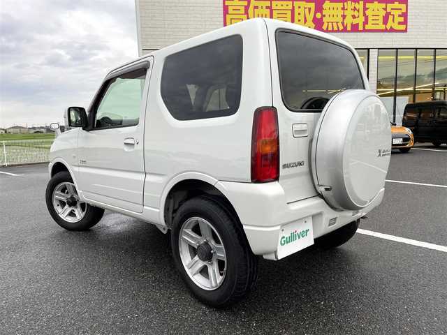 スズキ ジムニー クロスアドベンチャー 鳥取県 2013(平25)年 5.9万km パールホワイト ４ＷＤ・ターボ/社外ナビ／フルセグ／ＤＶＤ／ＣＤ／ＢＴ/黒／赤レザーシート/シートヒーター/キーレスキー/ウィンカーミラー/電動格納ミラー/純正16インチアルミホイール/純正フォグライト/４ＷＤ切替スイッチ/背面タイヤ/フロアマット/ドアバイザー