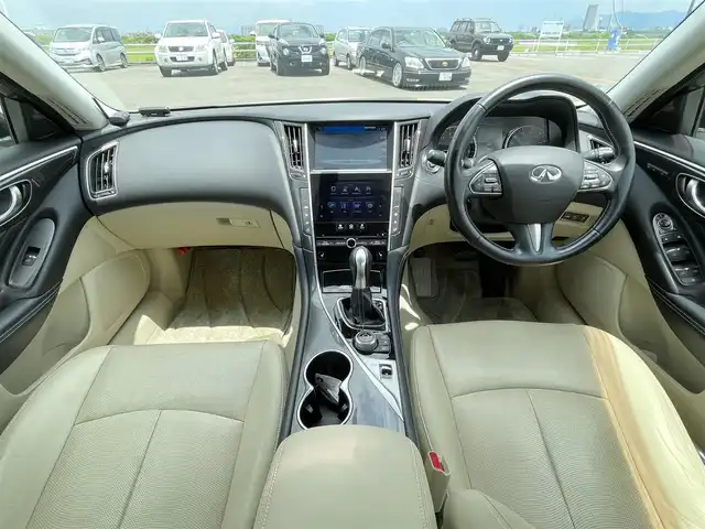 日産 スカイライン ハイブリッド 350GT Type P 佐賀県 2014(平26)年 9.2万km クリスタルホワイトパール ワンオーナー/ベージュ革シート/純正8インチSDナビ/・フルセグTV/AM/FM/CD/USB/Bluetooth/アラウンドビューモニター/ビルトインETC/D＋N席パワーシート(D席メモリー機能付)/D＋N席シートヒーター/革巻きステアリング/ステアリングリモコン/純正17インチアルミホイール/純正キセノンヘッドライト/純正LEDフォグライト/純正フロアマット/純正ドアバイザ―/新車保証書/取扱説明書/スペアキー１本/インテリジェントクルーズコントロール/車線逸脱警報（LDW）/車線逸脱防止支援システム（LDP）/ブラインドスポットワーニング/エマージェンシーブレーキ/インテリジェントペダル